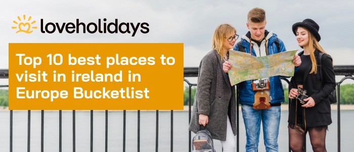 Travel banner showing three young tourists holding a map with text ‘Top 10 best places to visit in Ireland in Europe Bucketlist’ and LoveHolidays logo.